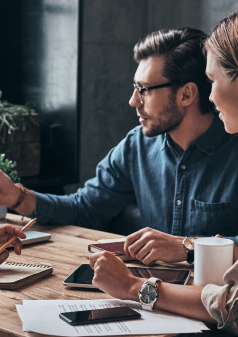 Business,Professionals.,Group,Of,Young,Confident,Business,People,Analyzing,Data