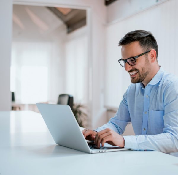Portrait,Of,Young,Man,Sitting,At,His,Desk,In,The